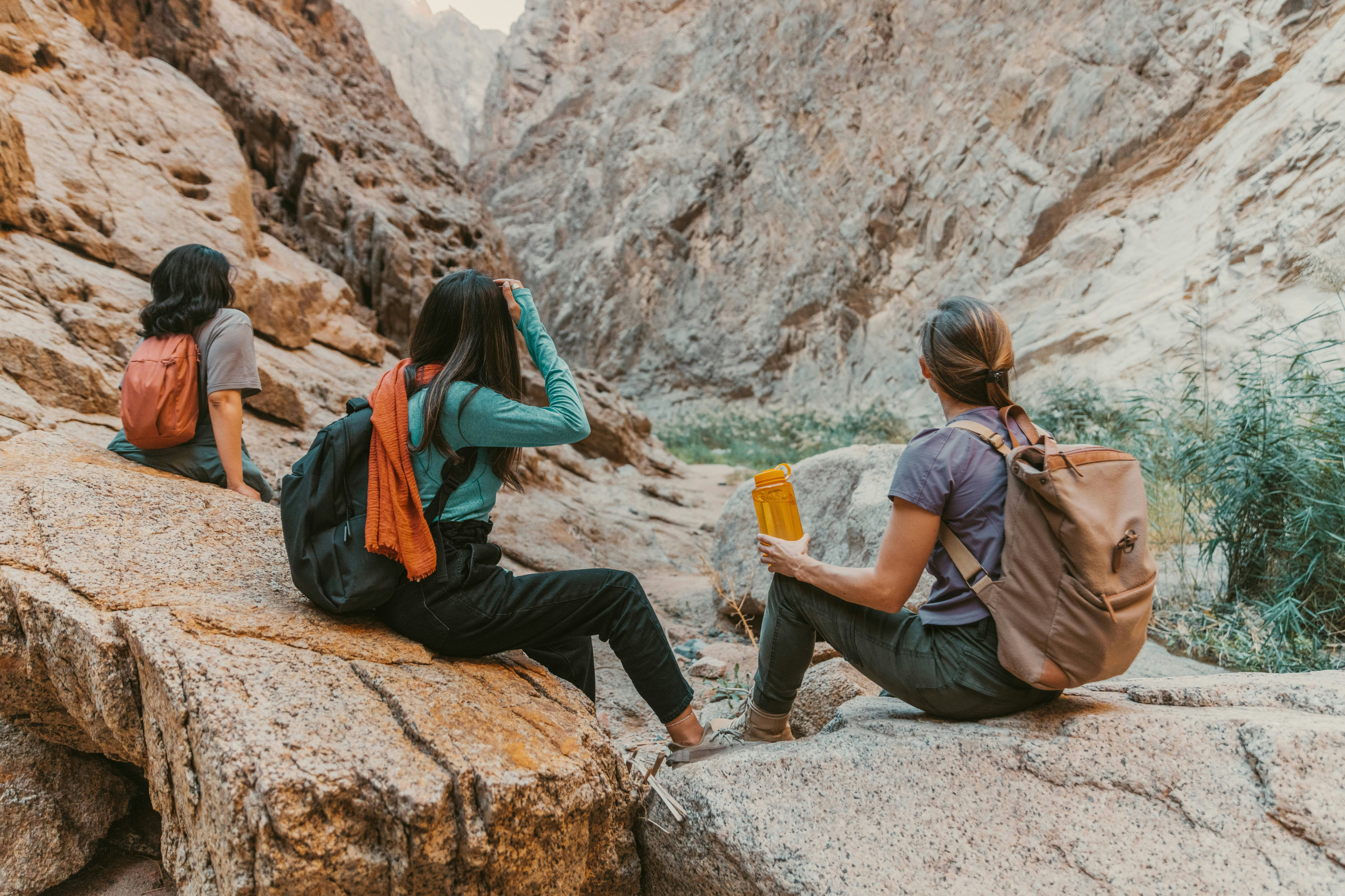 Travelers hiking in canyon