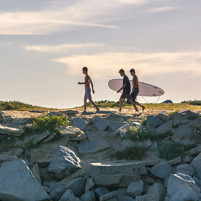Surfers walking